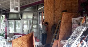 Boarding up the sunroom at the back of the Horton House.